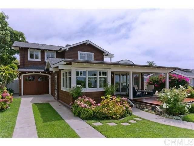 111 10th Street Del Mar, CA 92014 - Photo 21 of 23 a front view of a house with a yard and potted plants