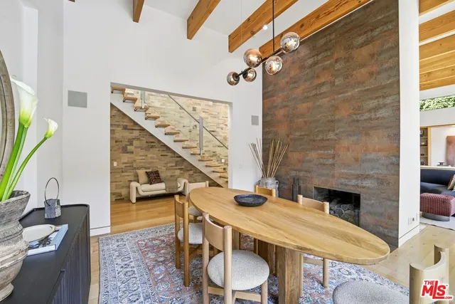 a balcony with table and chairs