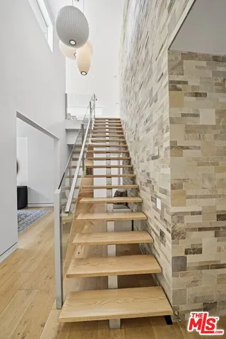 a view of staircase with white walls