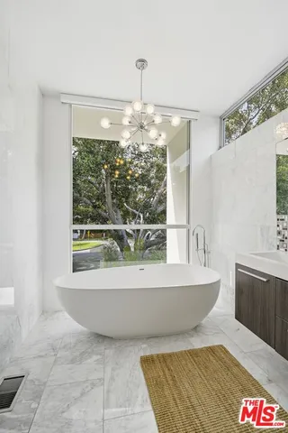 a bathroom with a bathtub and sink