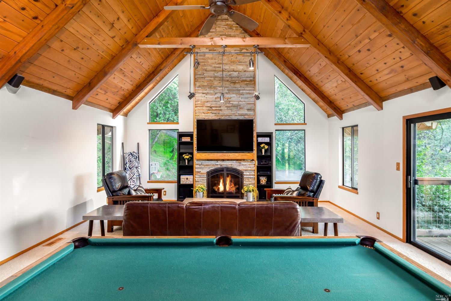 449 Ridge Road Novato, CA 94947 - Photo 1 of 1 a living room with furniture a flat screen tv and a fireplace