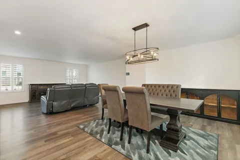 an aerial view of residential building with swimming pool