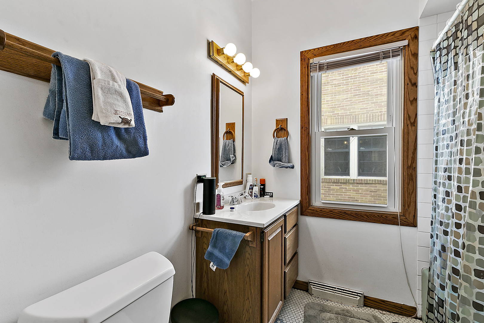 312 Gage Road Riverside, IL 60546 - Photo 12 of 26 a bathroom with a sink and a mirror