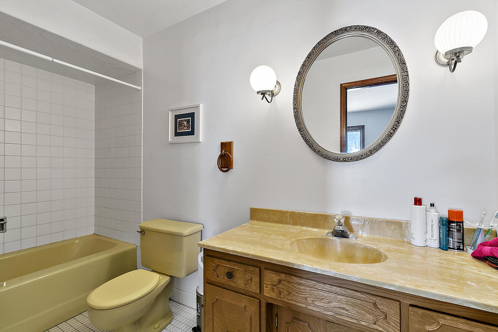 312 Gage Road Riverside, IL 60546 - Photo 13 of 26 a bathroom with a sink a toilet and a mirror