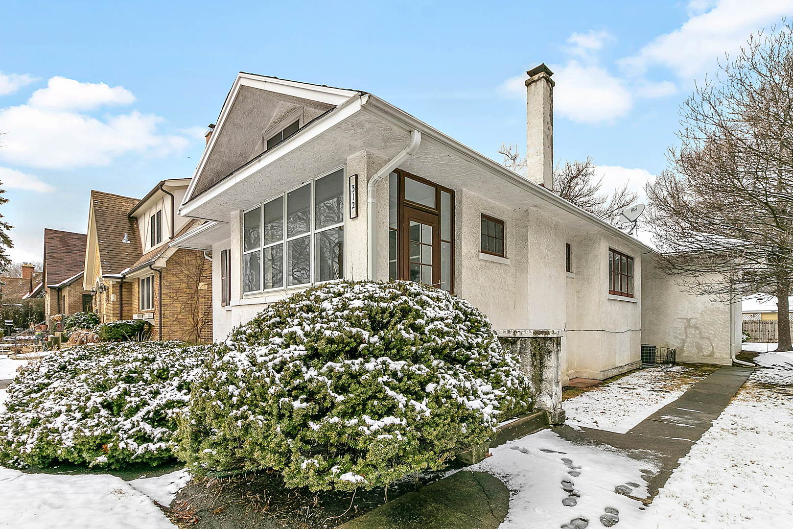 312 Gage Road Riverside, IL 60546 - Photo 2 of 26 a front view of a house with a garden