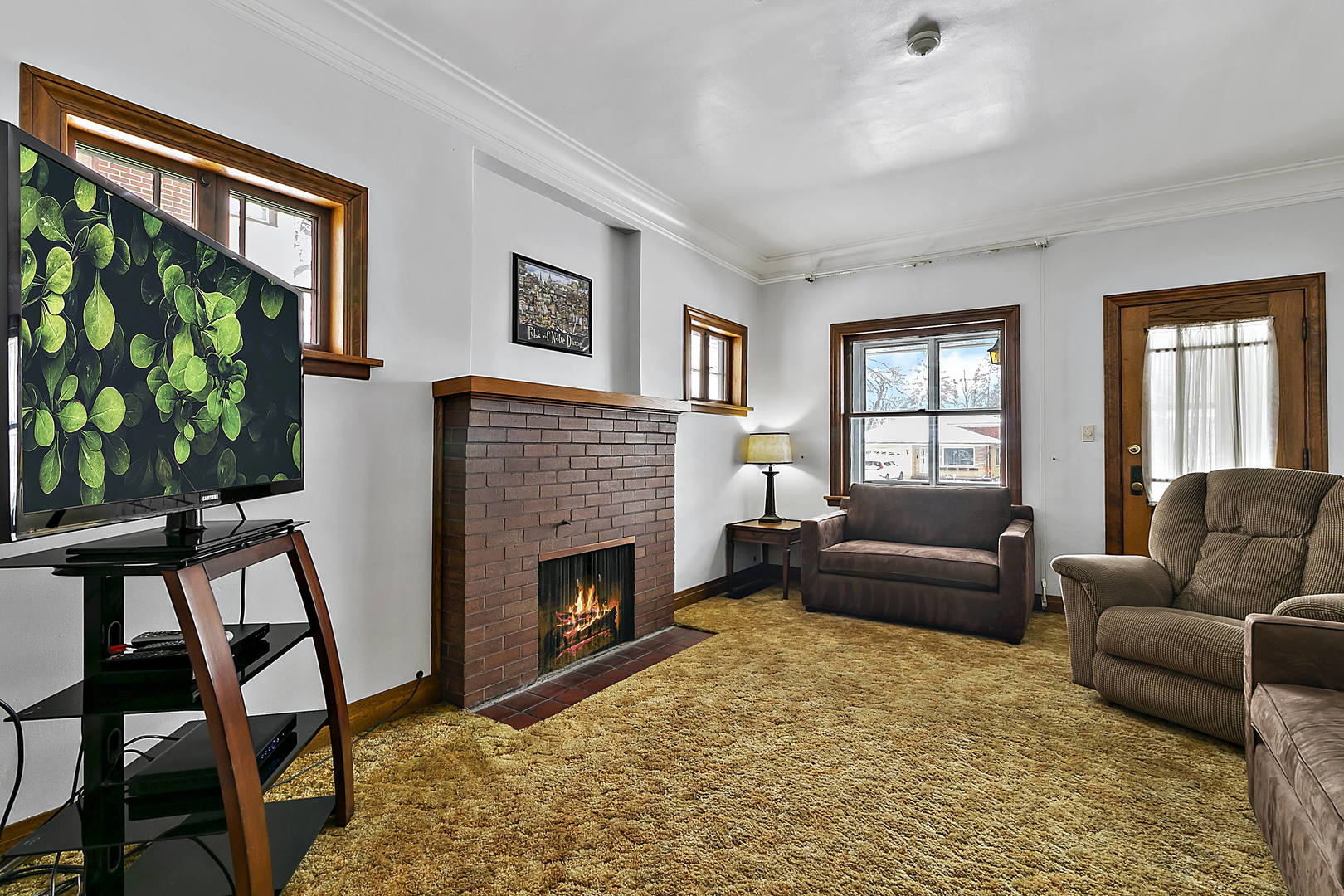 312 Gage Road Riverside, IL 60546 - Photo 3 of 26 a living room with furniture and a fireplace