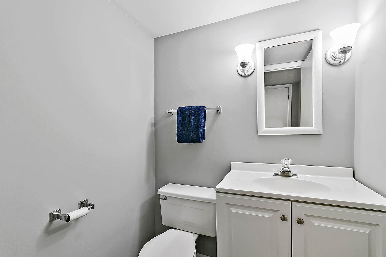 312 Gage Road Riverside, IL 60546 - Photo 10 of 26 a bathroom with a toilet sink and mirror