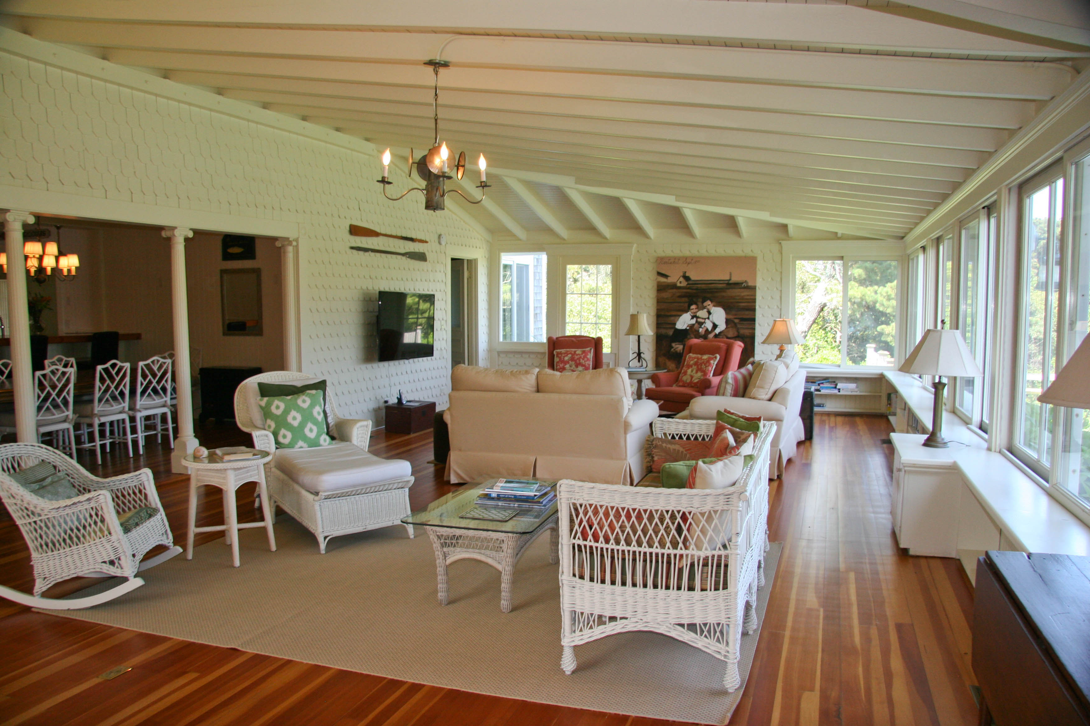 144 Surfside Road Nantucket, MA 02554 - Photo 11 of 46 a living room with furniture a fireplace and wooden floor