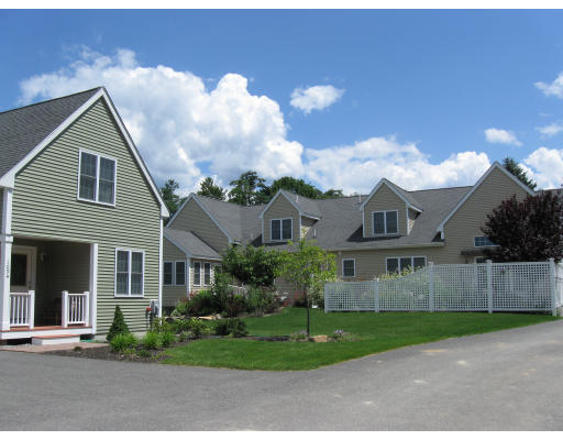 1088 Hill Road, Unit 1 Boxborough, MA 01719 - Photo 1 of 1 a front view of a house with a yard