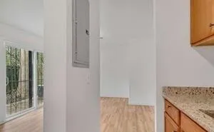 a view of a kitchen from an empty room