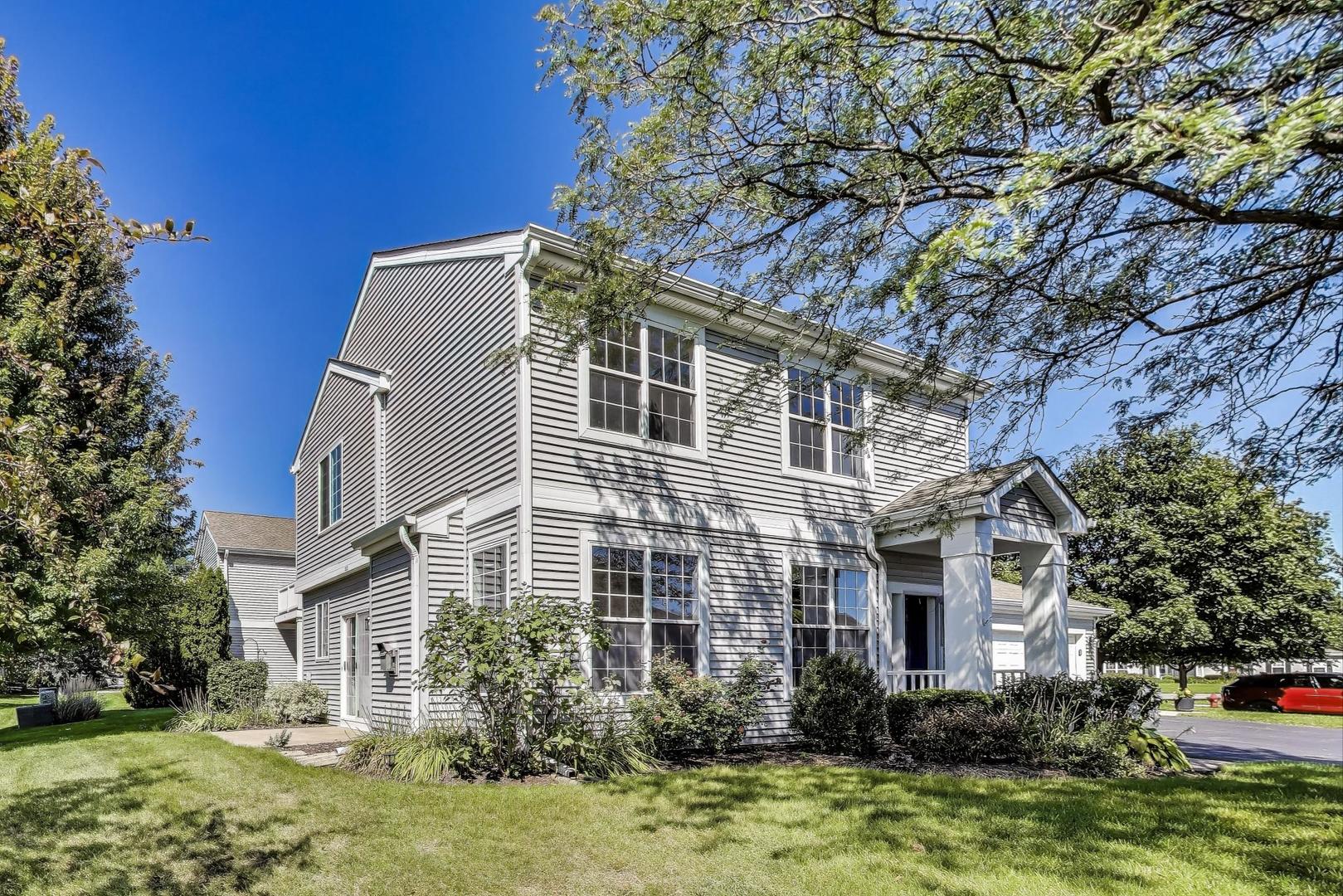383 Cascade Lane Oswego, IL 60543 - Photo 2 of 35 a front view of a house with garden