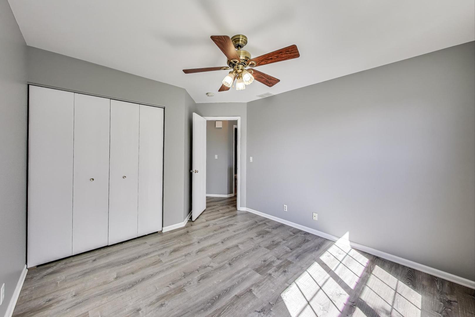 383 Cascade Lane Oswego, IL 60543 - Photo 25 of 35 wooden floor in an empty room with a window