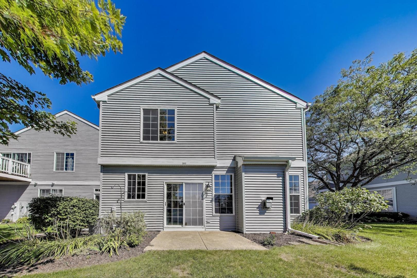 383 Cascade Lane Oswego, IL 60543 - Photo 28 of 35 front view of a house with a yard