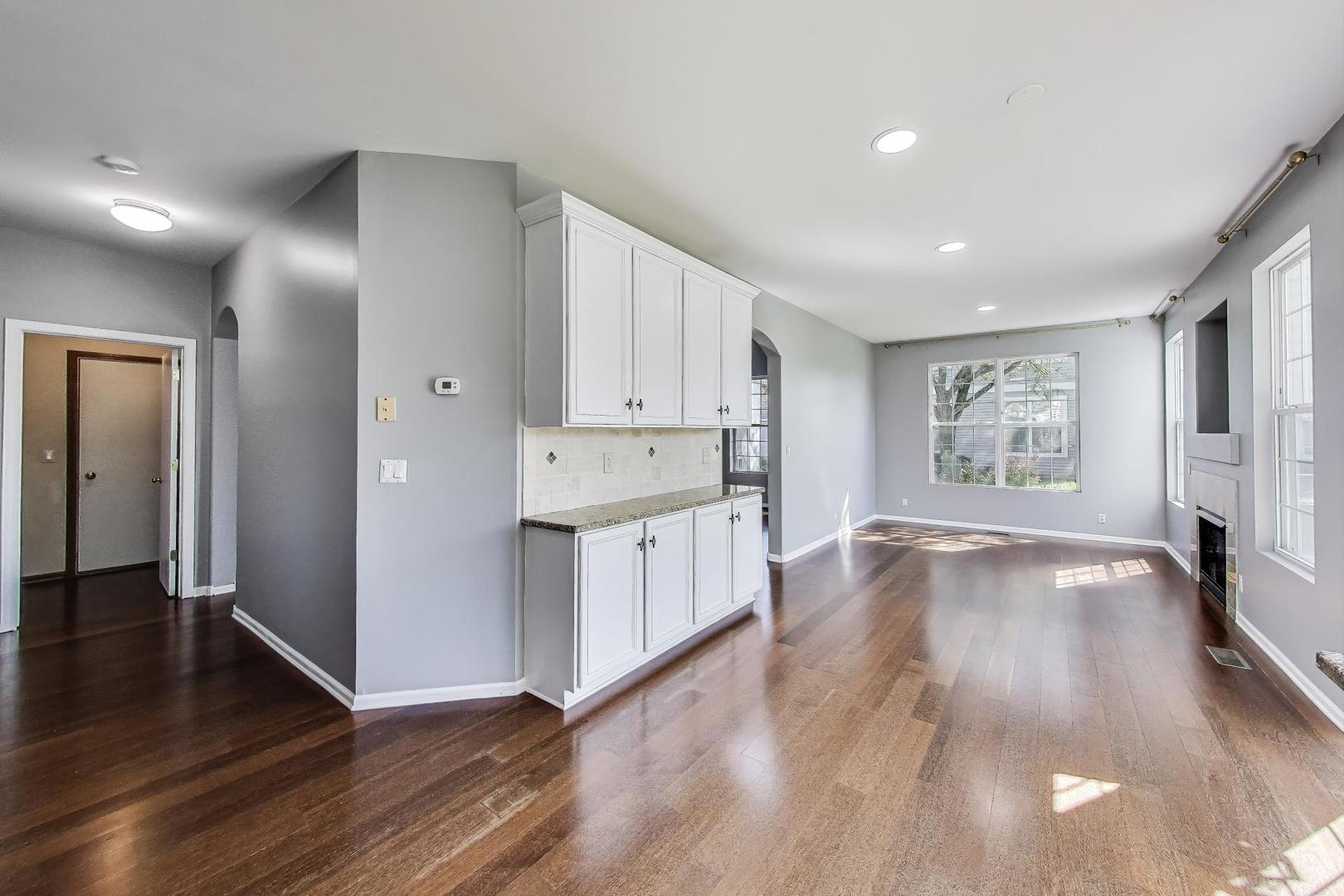 383 Cascade Lane Oswego, IL 60543 - Photo 9 of 35 a view of kitchen with stove and wooden floor
