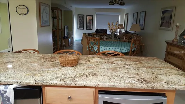 a view of a livingroom with furniture and a flat screen tv