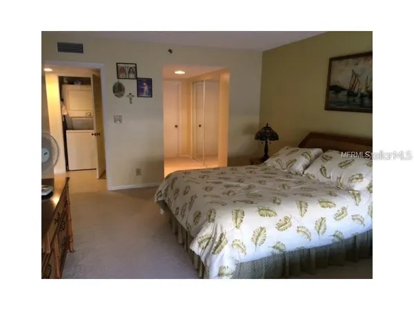 a bedroom with a bed and furniture