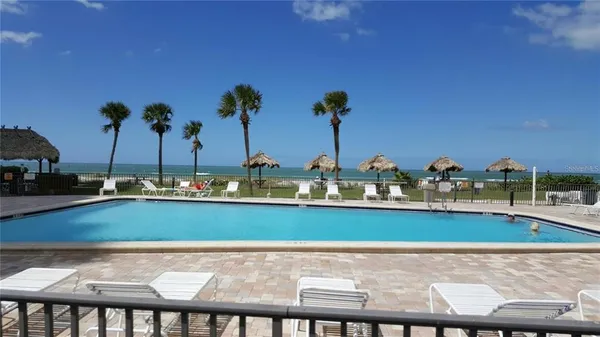 a view of swimming pool and outdoor seating