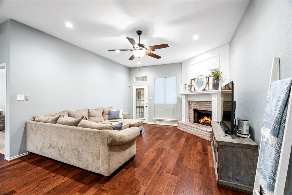 2302 Randi Road Rowlett, TX 75088 - Photo 4 of 33 a living room with furniture and a fireplace
