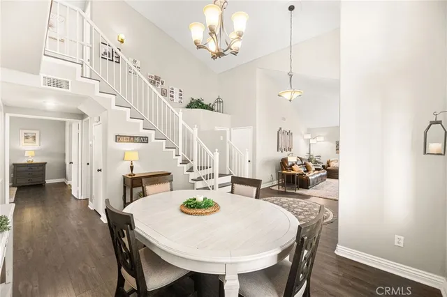 a living room with furniture and a book shelf
