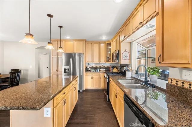 a kitchen with a sink and a large window