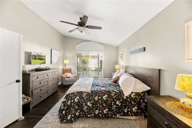 a view of a hallway with wooden floor and stairs