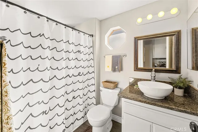 a patio with a table and chairs and garden