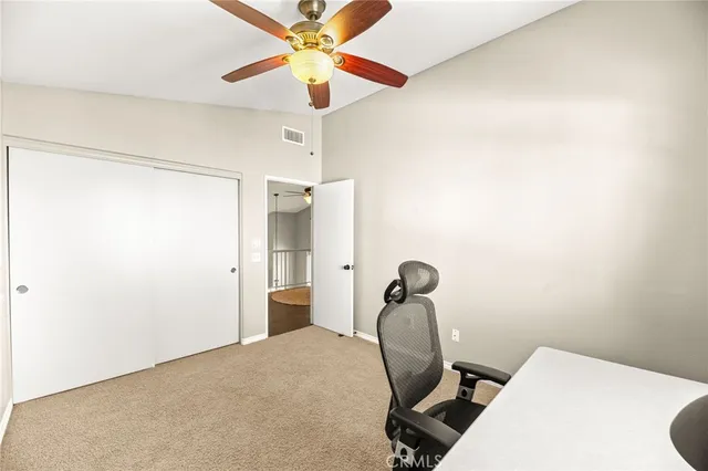 a view of a backyard with a patio and swimming pool