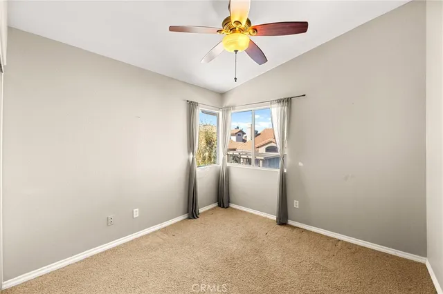 a view of a backyard with table and chairs and potted plants