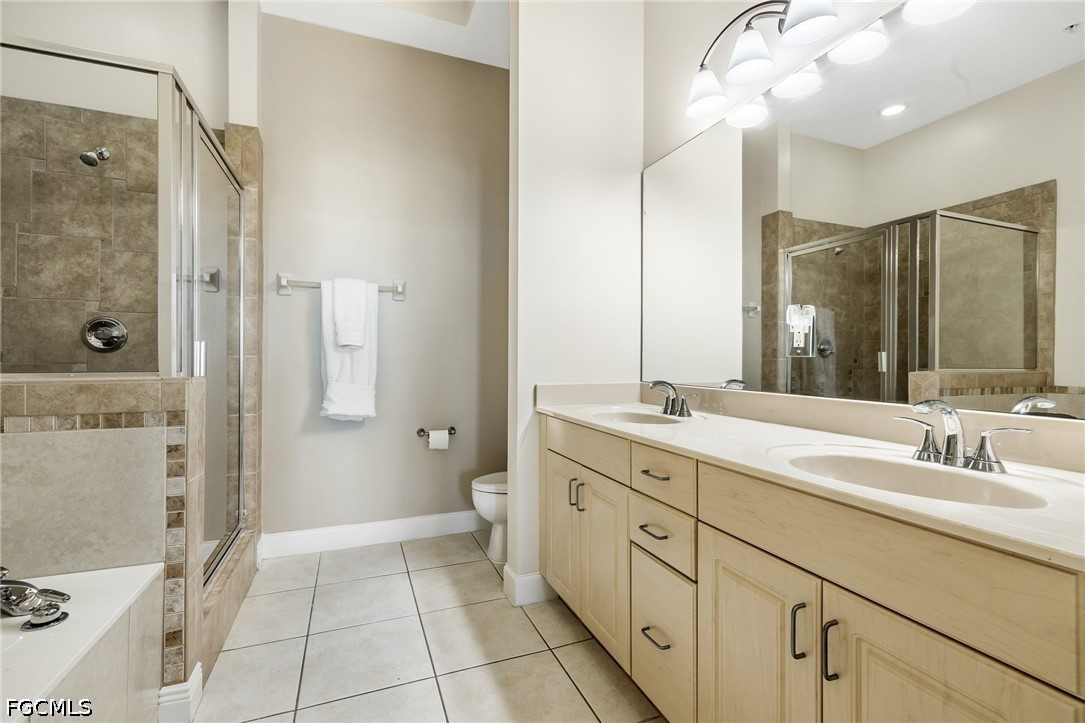 2745 First Street, Unit 2703 Fort Myers, FL 33916 - Photo 25 of 34 a bathroom with a double vanity sink mirror and shower