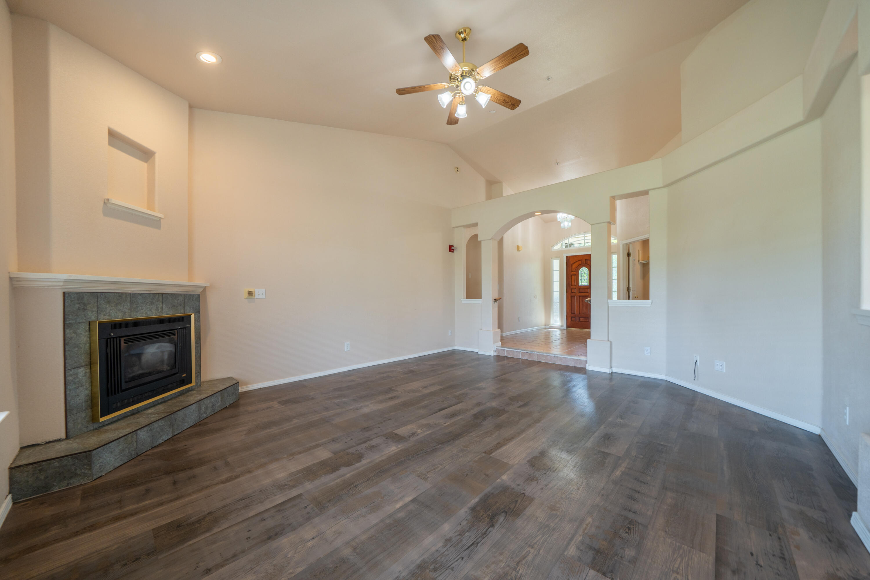 3438 Showboat Court Redding, CA 96003 - Photo 12 of 63 a view of an empty room with chandelier and fireplace