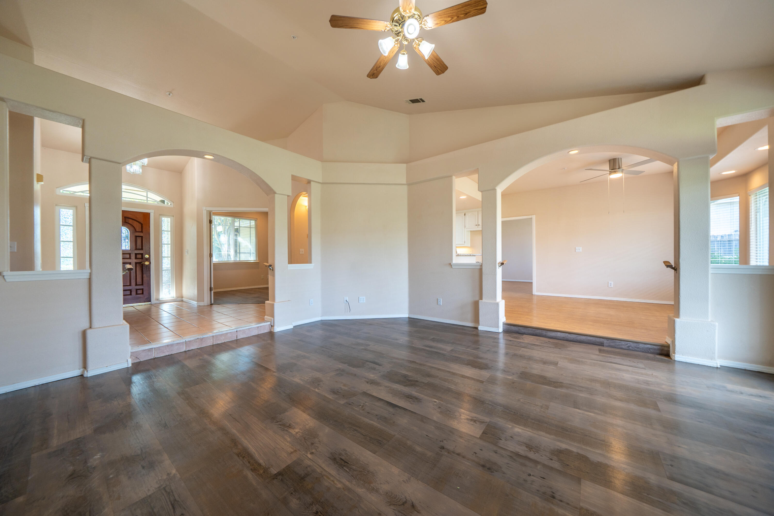 3438 Showboat Court Redding, CA 96003 - Photo 13 of 63 a view of an empty room with wooden floor and a living room