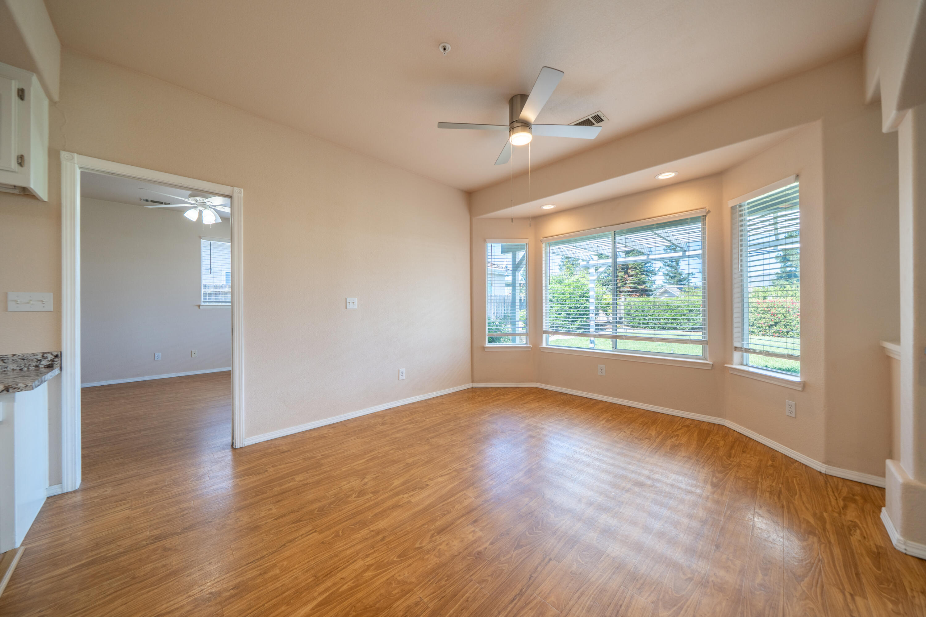 3438 Showboat Court Redding, CA 96003 - Photo 14 of 63 a view of a livingroom with wooden floor and a large window