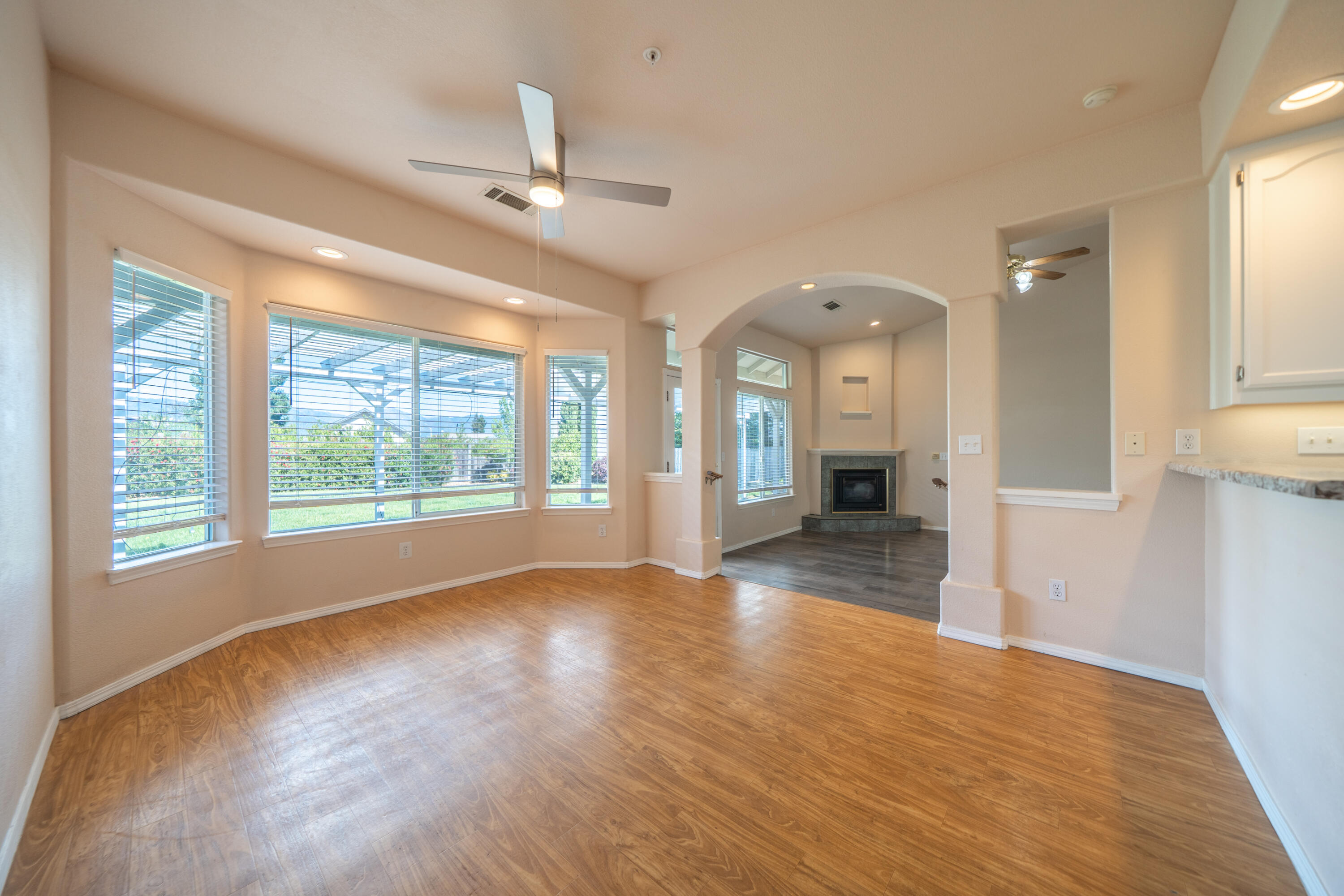 3438 Showboat Court Redding, CA 96003 - Photo 15 of 63 a view of an empty room with window and wooden floor