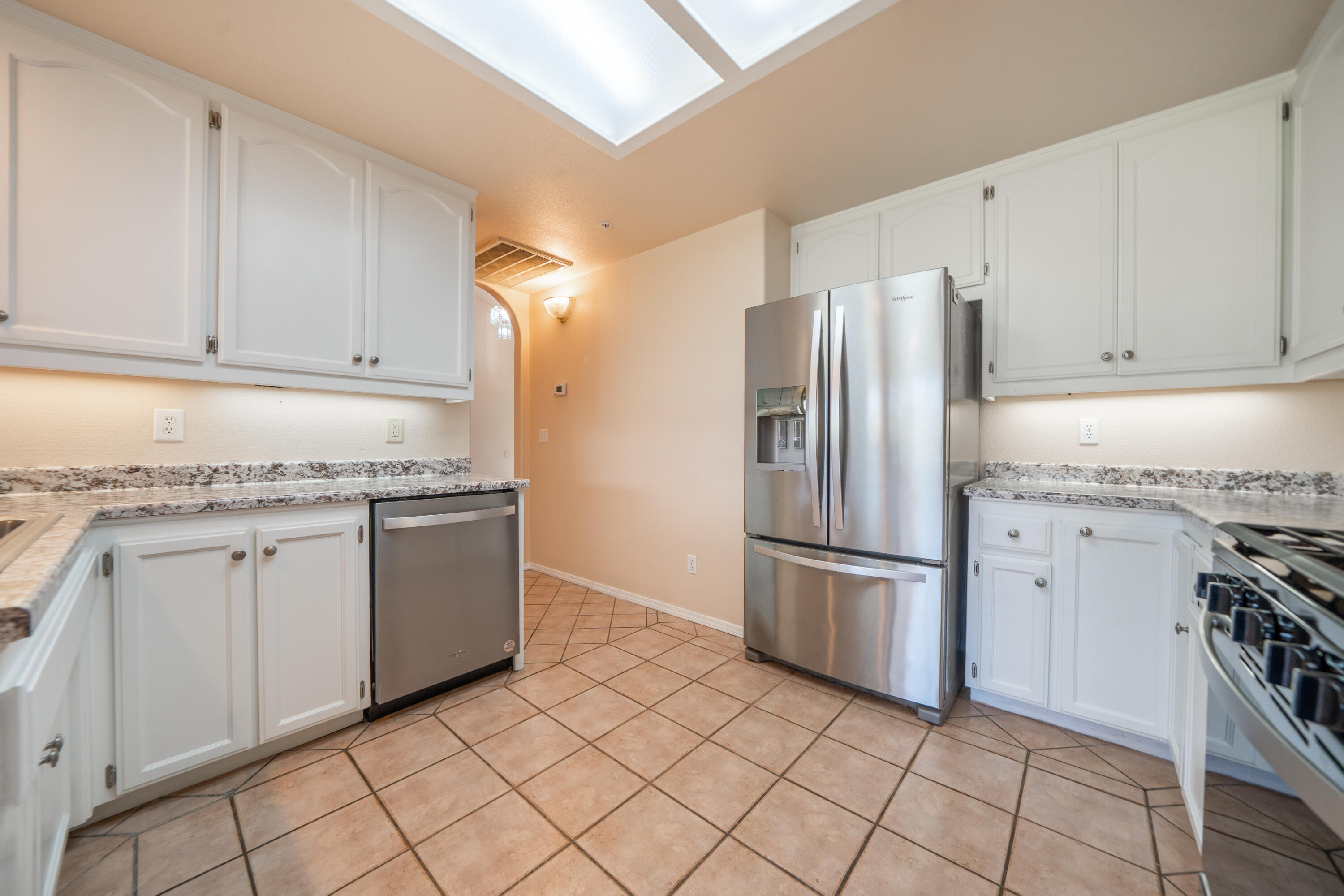 3438 Showboat Court Redding, CA 96003 - Photo 21 of 63 a kitchen with granite countertop cabinets and steel stainless steel appliances