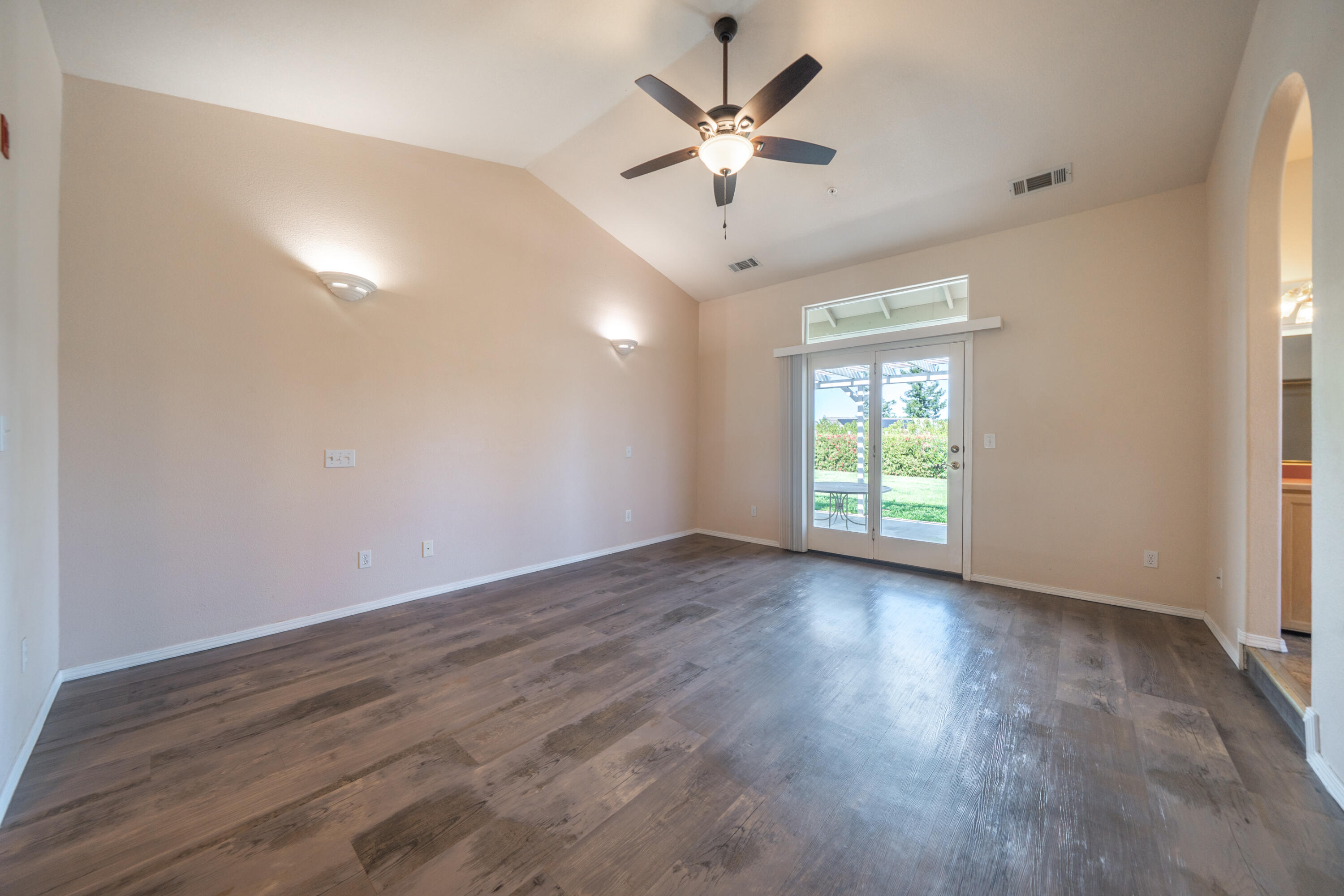 3438 Showboat Court Redding, CA 96003 - Photo 30 of 63 an empty room with wooden floor and windows