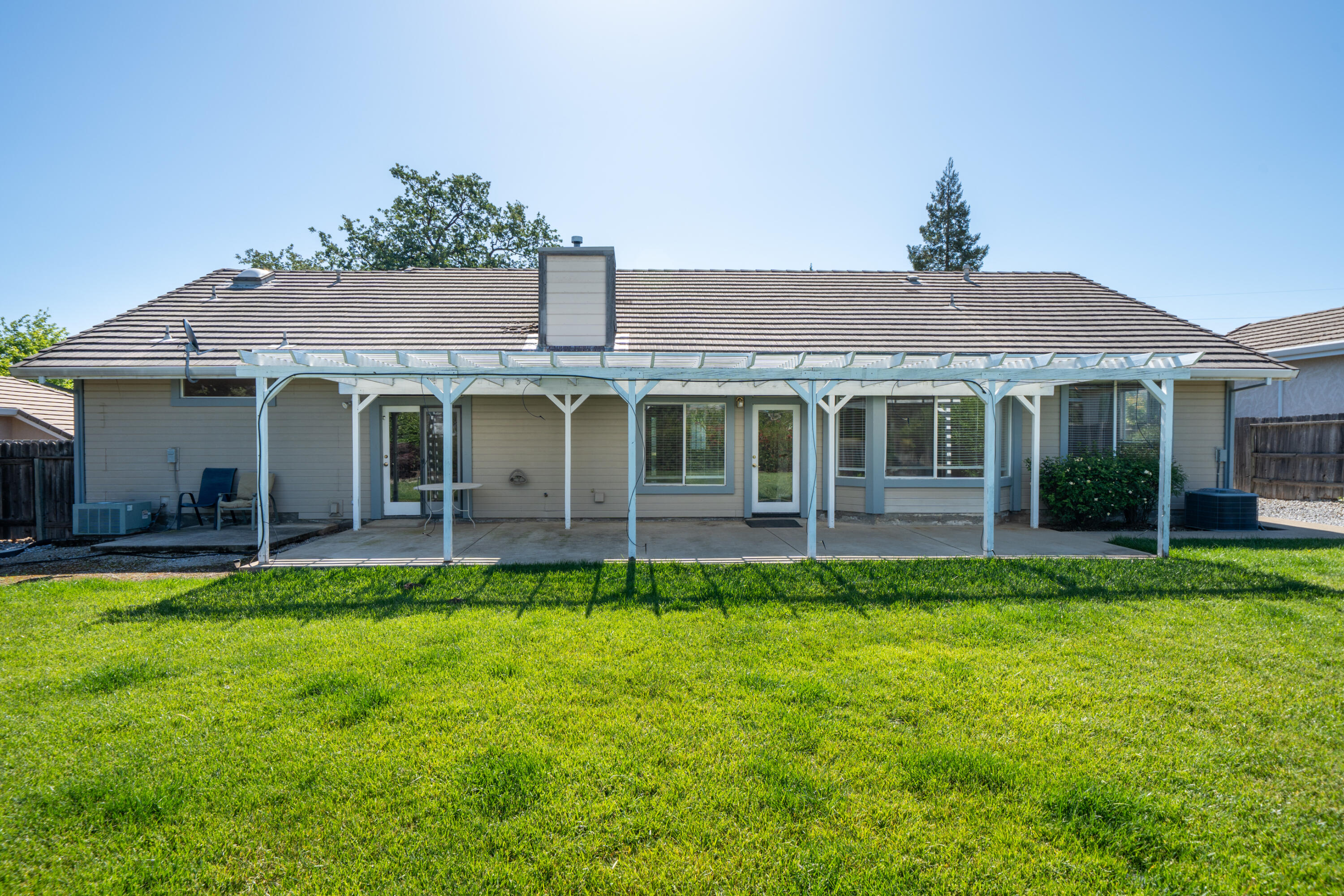 3438 Showboat Court Redding, CA 96003 - Photo 47 of 63 a front view of a house with a garden