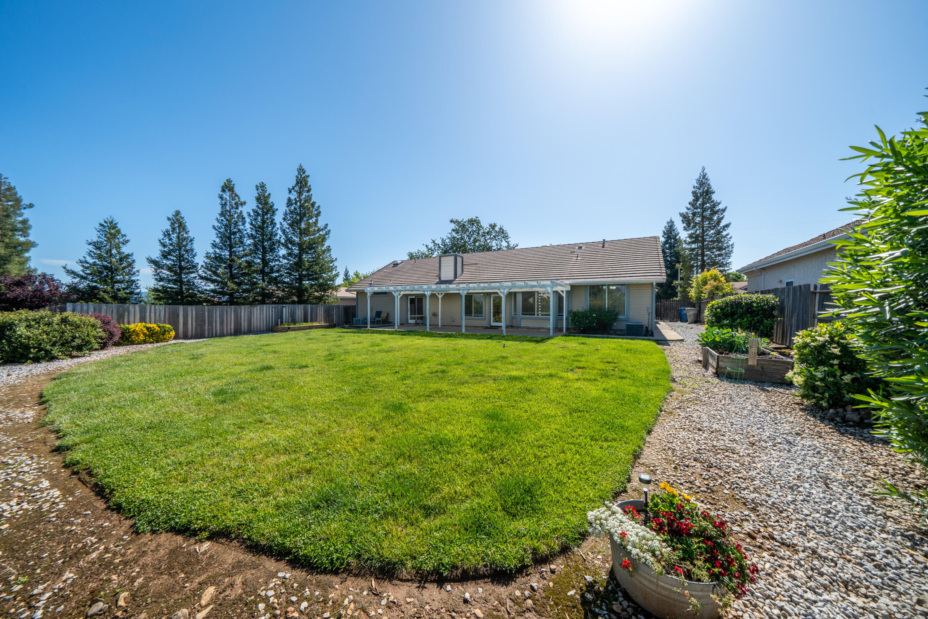 3438 Showboat Court Redding, CA 96003 - Photo 51 of 63 a front view of a house with garden
