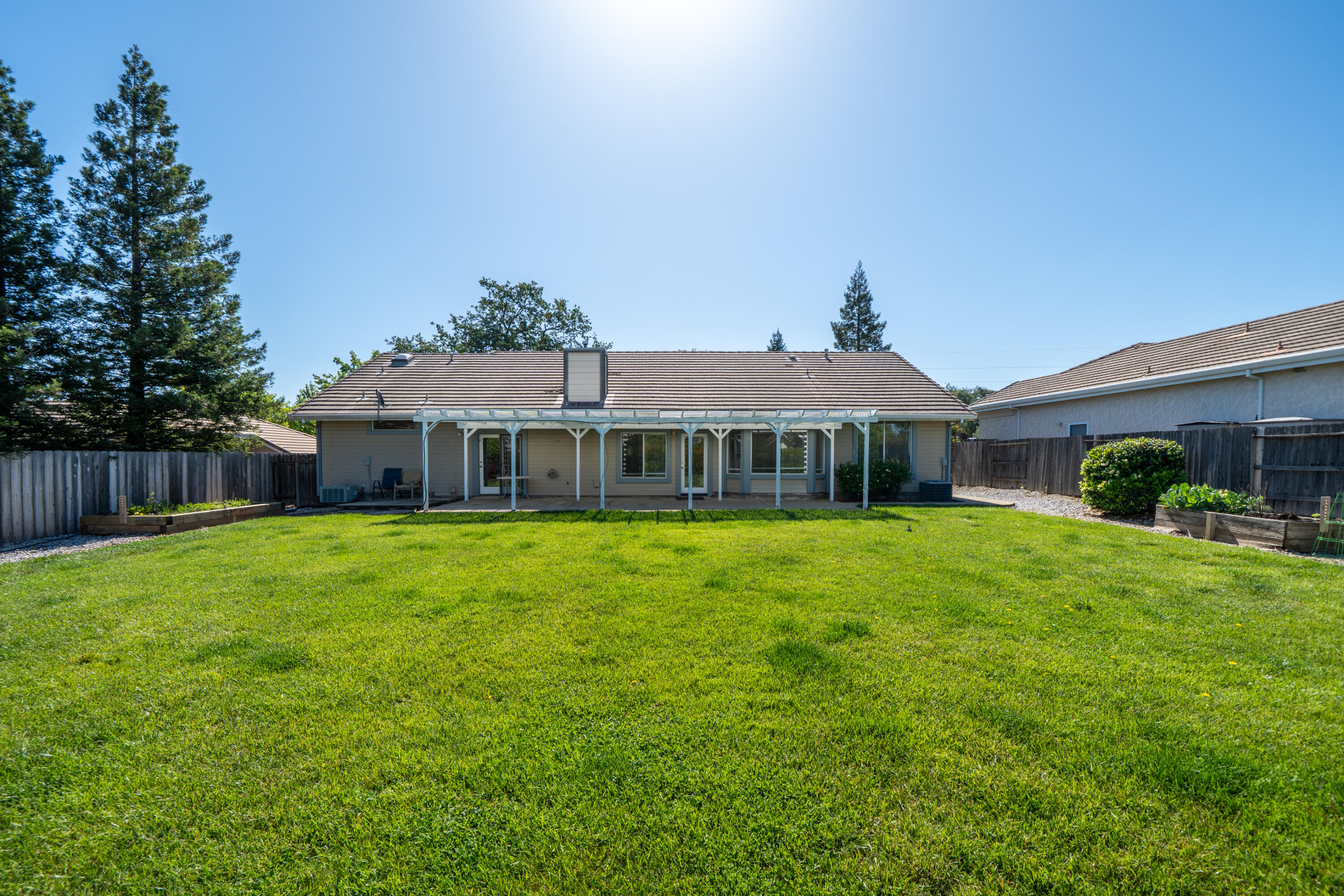 3438 Showboat Court Redding, CA 96003 - Photo 52 of 63 a front view of a house with a garden