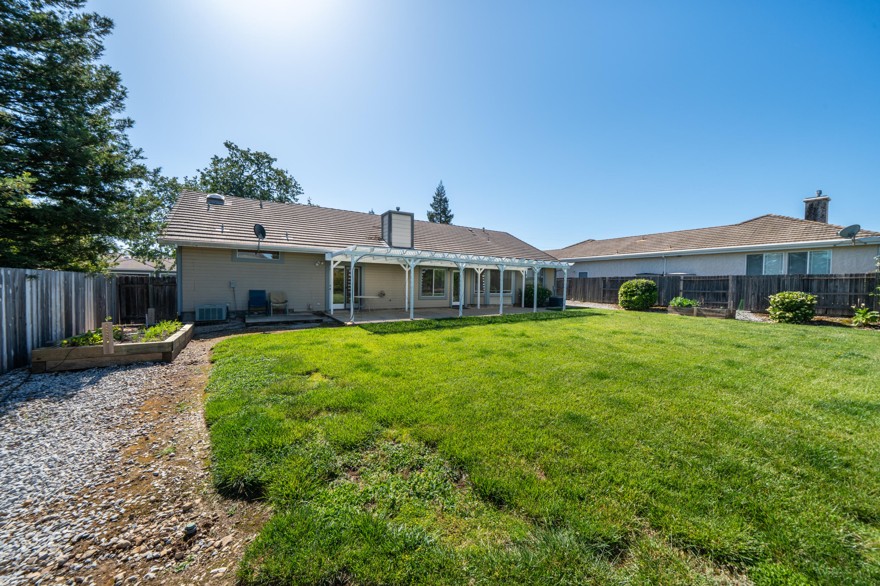 3438 Showboat Court Redding, CA 96003 - Photo 53 of 63 a front view of a house with garden