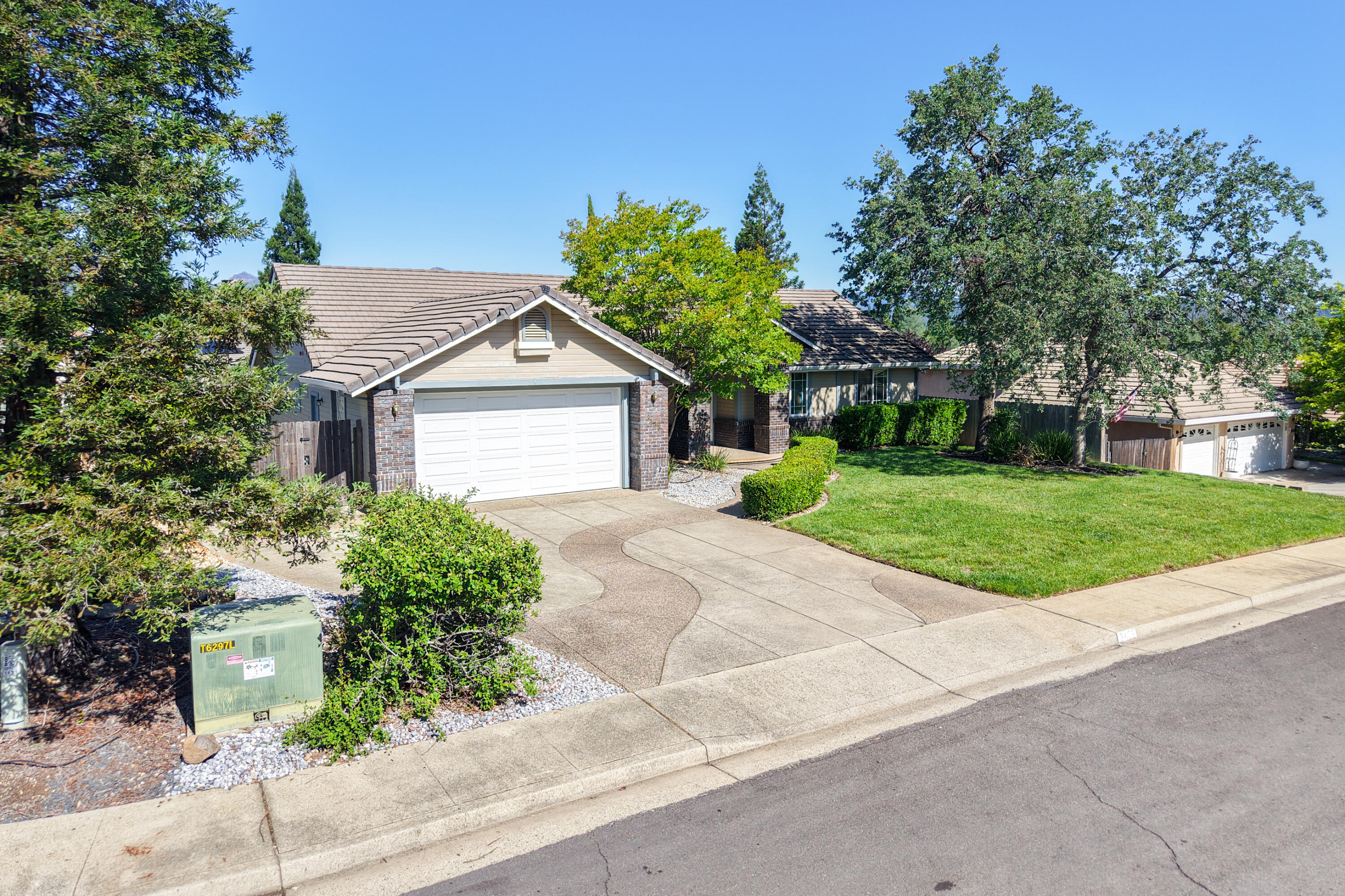 3438 Showboat Court Redding, CA 96003 - Photo 56 of 63 a front view of house with yard and green space