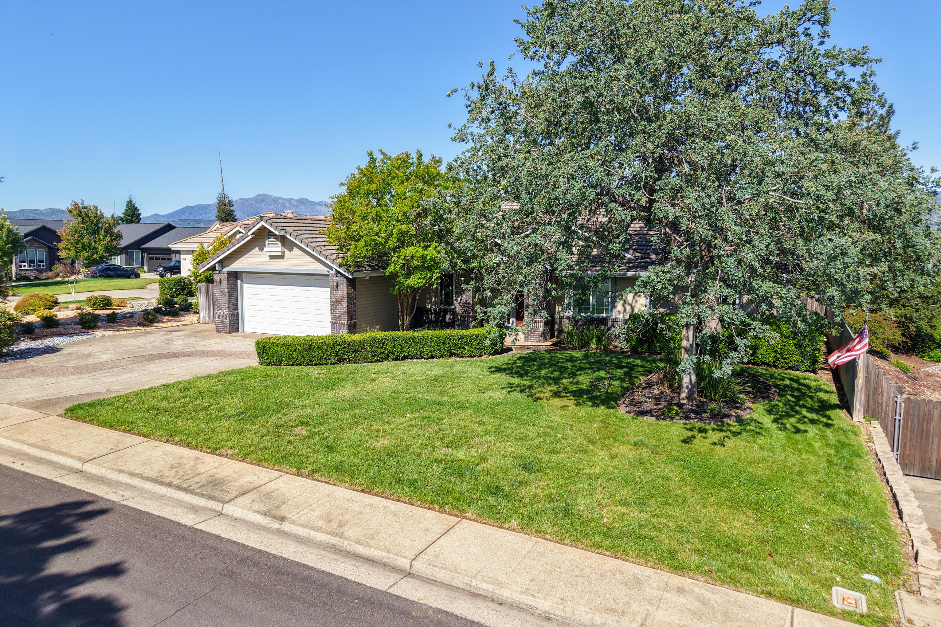 3438 Showboat Court Redding, CA 96003 - Photo 58 of 63 a front view of a house with a yard