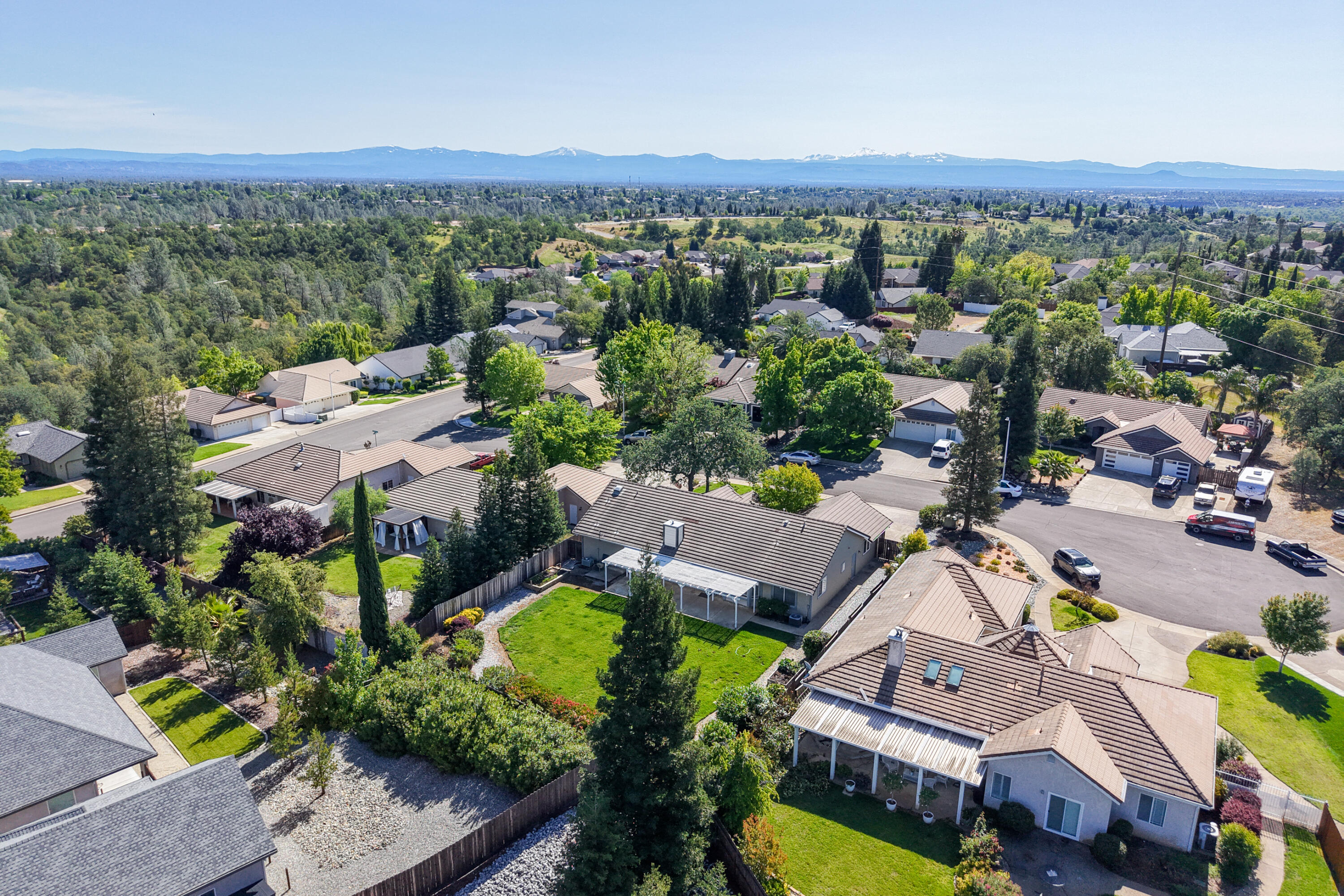 3438 Showboat Court Redding, CA 96003 - Photo 59 of 63 an aerial view of a city with lots of residential buildings and mountain view in back