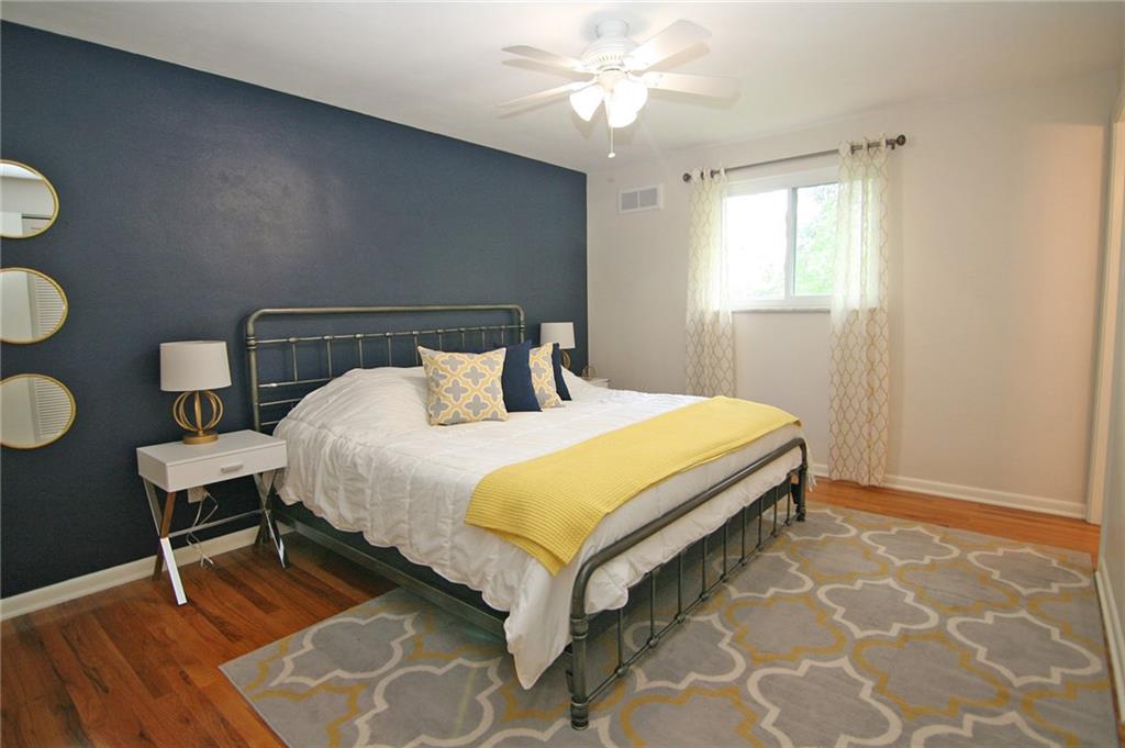 538 Center Church Road Canonsburg, PA 15317 - Photo 15 of 25 Master bedroom suite with TWO double closets and a private bath...Notice the hardwood flooring and lighted ceiling fan.