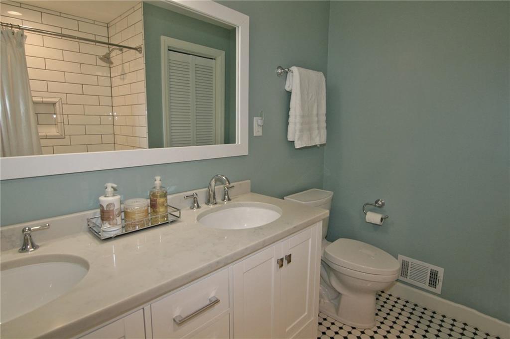 538 Center Church Road Canonsburg, PA 15317 - Photo 19 of 25 Updated hall bath! Tile flooring, double vanity with marble top, combo tub/shower with subway tile surround...