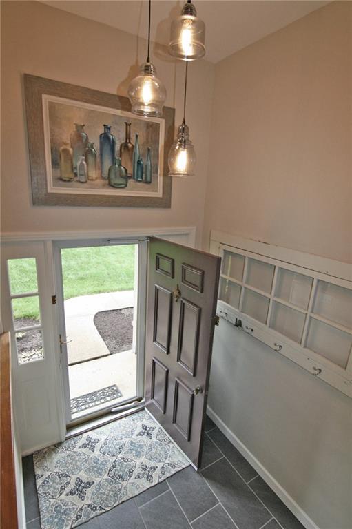 538 Center Church Road Canonsburg, PA 15317 - Photo 3 of 25 Setting a tone of warm welcome! Updated tile flooring and lighting...the hanging "farm door" can stay!