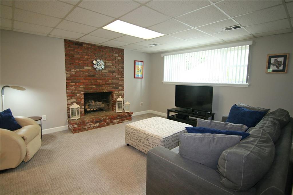 538 Center Church Road Canonsburg, PA 15317 - Photo 21 of 25 Daylight, walk-out gameroom...snuggle in front of the fireplace on movie night!