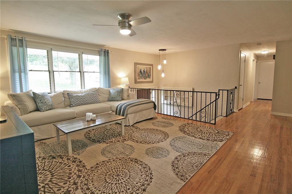 538 Center Church Road Canonsburg, PA 15317 - Photo 6 of 25 The living room/great room has hardwood flooring, updated paint, lighted ceiling fan...