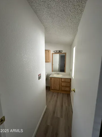 a bedroom with a bed and a view of bathroom