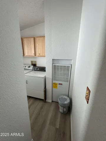 a bathroom with a sink a toilet and a window