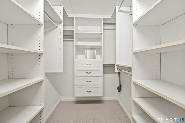 a view of an empty walk in closet
